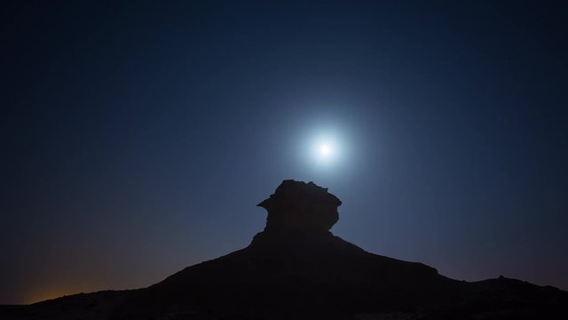 Qatar desert night moon waterless heat sand supermoon behind the stone
