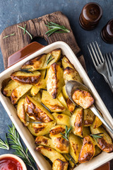 crispy spicy baked potatoes in baking dish