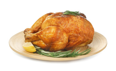 Plate with delicious whole roasted chicken on white background