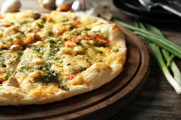 Delicious cheese pizza on wooden board. Fresh from oven
