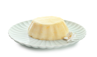 Plate with tasty vanilla pudding on white background