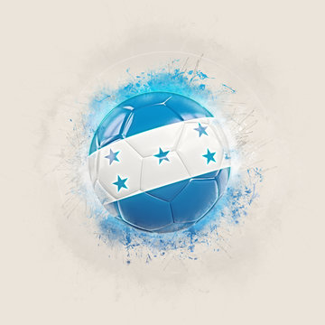 Grunge football with flag of honduras