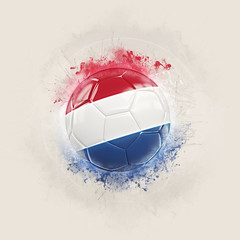 Grunge football with flag of netherlands