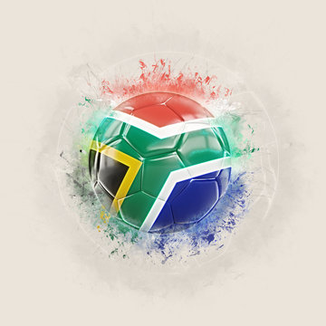 Grunge football with flag of south africa