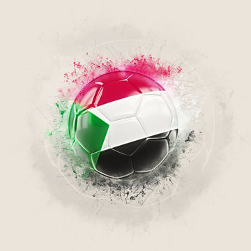 Grunge football with flag of sudan