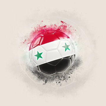 Grunge football with flag of syria