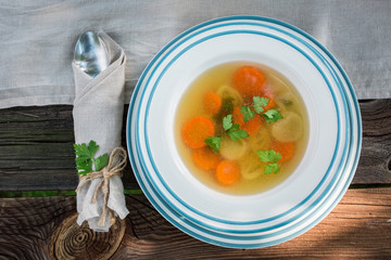 Fresh and tasty chicken soup served in the garden