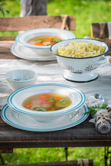 Homemade and healthy broth served on a sunny day