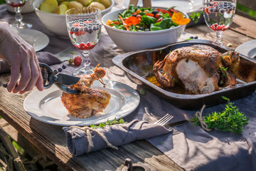 Healthy dinner with chicken and vegetables served in summer