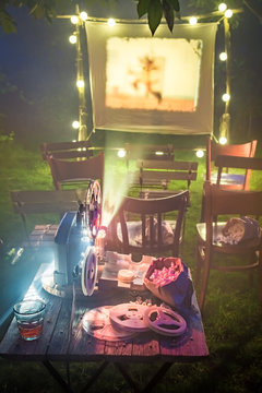 Open-air cinema with old analog films in the evening