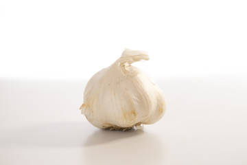 One Simple Garlic Bulb on a White Background