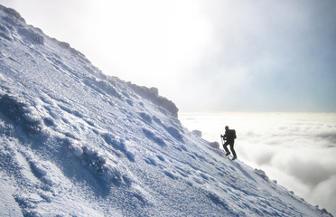 A climber rises above the cloud layer as they make the journey up Mt. Ngauruhoe on the north island...