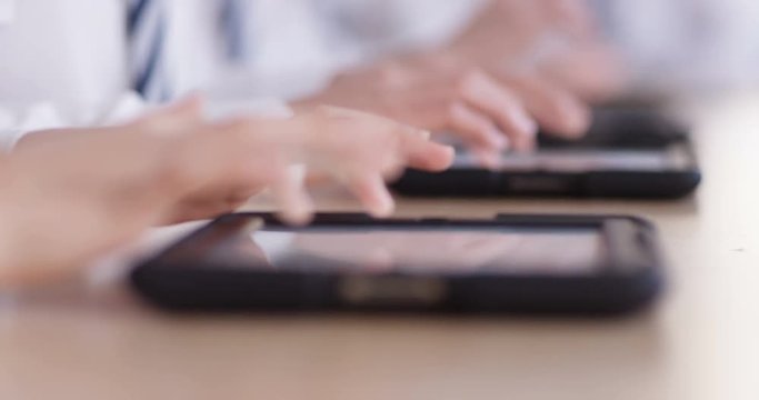4k, Teenagers using digital tablets classroom. Slow motion.