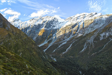Fototapeta na wymiar Mt. Aspiring is seen in the distance from a steep trail leading to Liverpool Hut in the Matukituki Valley on New Zealand's south island.