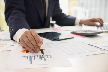 Business people meeting working with new startup project pointing graph discussion and analysis data charts and graphs.Business finances and accounting concept