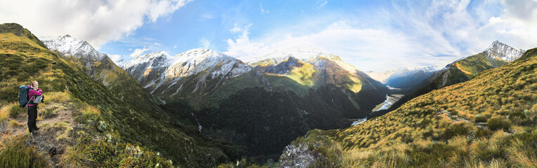 A hiker stops to admire a stunning view in the Mt. Aspiring National Park on New Zealand's south island.