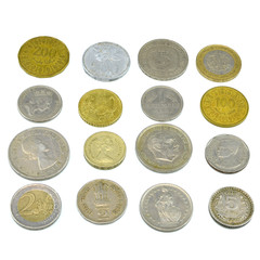Silver and copper coins from around the world on isolated background

