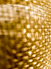 Gold mesh net with focus and shallow depto fo field, gold bokeh net pattern - 190832114