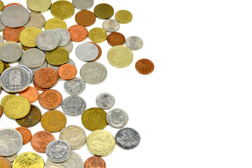 Silver and copper coins from around the world on isolated background
