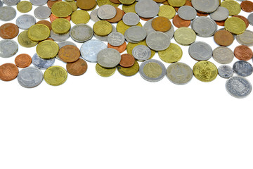 Silver and copper coins from around the world on isolated background

