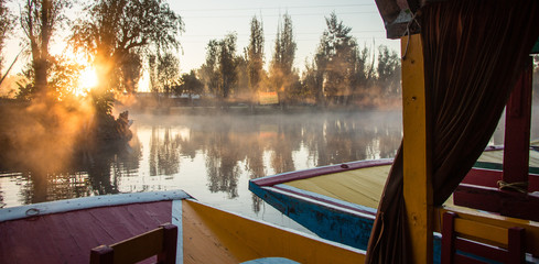 Beautiful hand-painted trajineras, traditional colorful boats from Xochimilco used to navigate in the canals