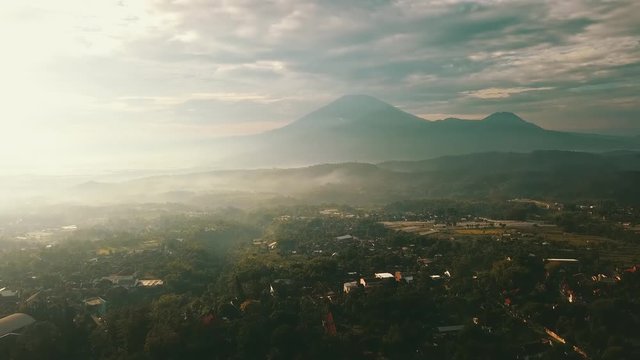Beautiful aerial view of village with mountain background in Semarang, Indonesia. Shot in 4k resolution on misty morning