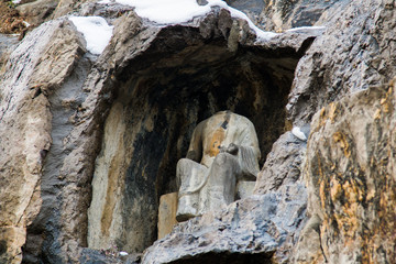 Close-up Stone Buddha Statue Carved from the mountains in winter
