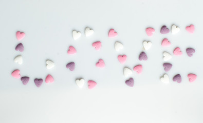 Color sugar sprinkle dots, decoration for cake and bekery, a lot of sprinkles as a background. Love