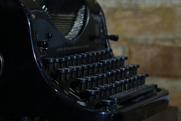 Details of an old retro typewriter, vintage style, dusty surfaces.
