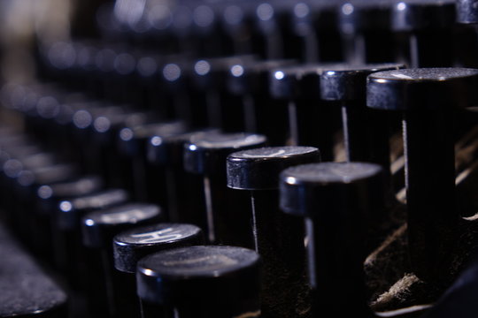 Details of an old retro typewriter, vintage style, dusty surfaces.
