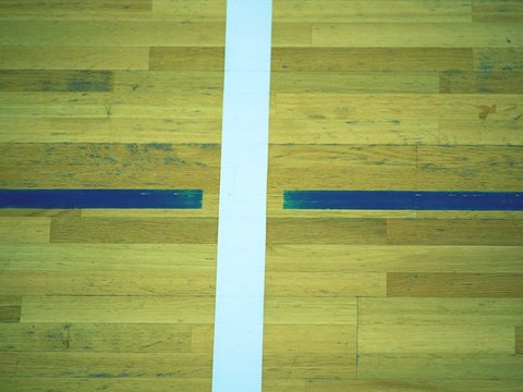 Painted wood floor ,parquet hardwood in basketball court. The  floor viewed from above