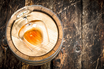 barrel with a glass of cognac.