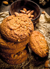 Oatmeal cookies in a bowl with nuts.