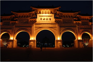 A main gate into Liberty Sqaure and Democracy Boulevard by Chiang Kai-Shek Memorial Hall lighted in the evening, Taipei, Taiwan