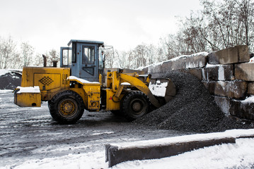 Tractor ships coal bucket.