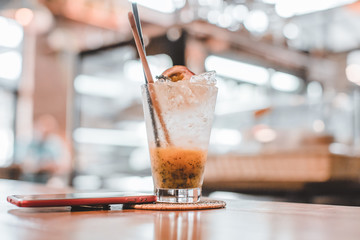 passion fruit with soda mint on wooden table, copy space, healthy concept