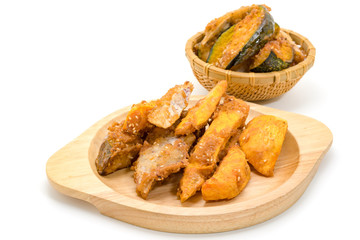 Fried banana fritters on with wood plate