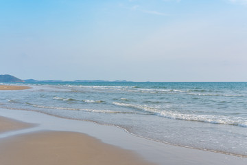 Fototapeta na wymiar Surf wave is covering a sea beach sand