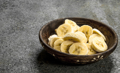 Sliced bananas in a bowl.