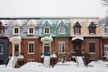 Typical row houses in Plateau Mont-Royal neighborhood in Montreal, Quebec, Canada during winter 