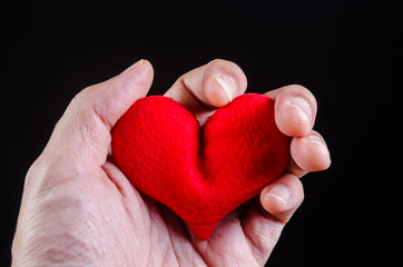 Fototapeta premium hand squeezing red heart ,heart attack , love problem concept