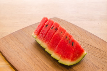 watermelon on wooden board background