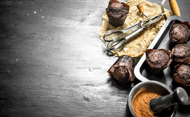 Chocolate muffins with ingredients.