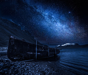 Milky way and old ship wreck at night, Iceland
