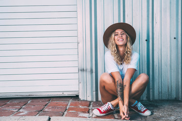 fashionista girl sitting in the backstreet.