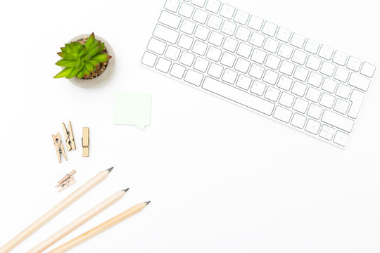 Keyboard and office supplies on a white background. Scandinavian style