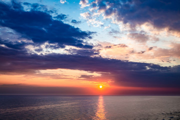 Stunning dusk over calm ocean in summer