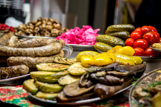 Street sale of food baked on the grill at the celebration. Selective focus