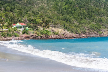 Typical colorful house in Guadeloupe, on a beach of the Saintes island, Terre-de-Bas
