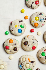 Homemade Cookies with Colorful Chocolate Candies on Bright Background, Copy Space